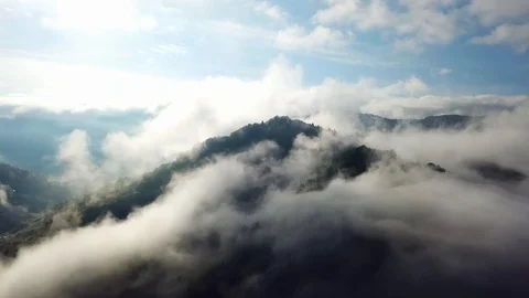 Aerial view of clouds in the mountains Stock Footage 121997299