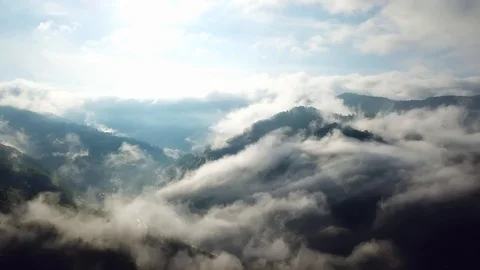 Aerial view of clouds in the mountains Stock Footage 121998657