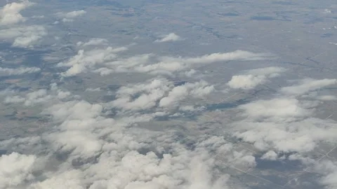 Aerial view of clouds over flat agricultural landscape in Oklahoma Stock Footage 338418136