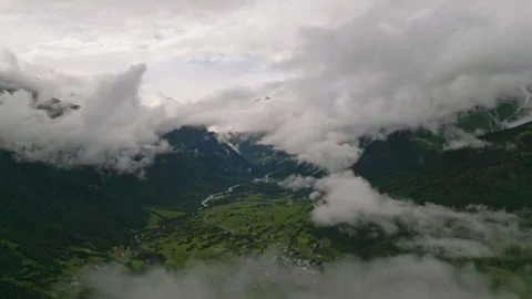 Aerial view of clouds over Mazeri village in Svaneti mountains. Green valleys Stock Footage 280866177