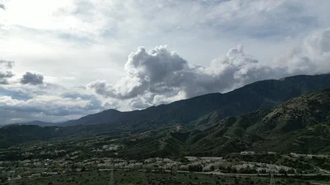 Aerial View of Clouds Over Mountains North of Claremont, California 動画素材 263999706