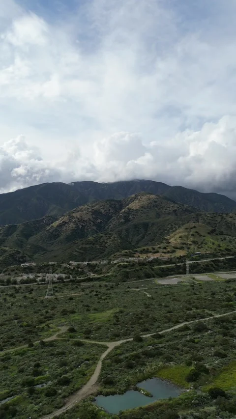 Aerial View of Clouds Over Mountains North of Claremont, California 動画素材 264000978
