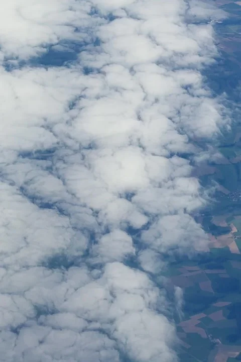 Aerial View of Clouds Over Patchwork Farmland and Countryside From an Airpl.. Stock Footage 347483407