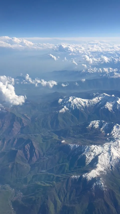 Aerial view of clouds over snowy mountains Stock Footage 334444080
