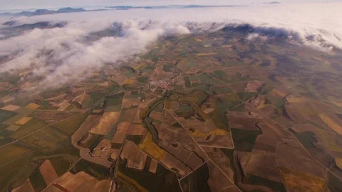 Aerial view of clouds rolling through mountains in La Rioja, Spain -wide pan Stock Footage 97984527