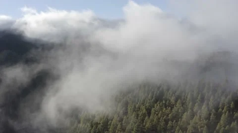 Aerial view. Clouds sea falling down from the mountain to valley-7. Drone shot. Stock Footage 158556975