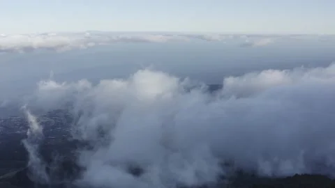 Aerial view. Clouds sea falling down from the mountain to valley-6. Drone. Stock Footage 158556984