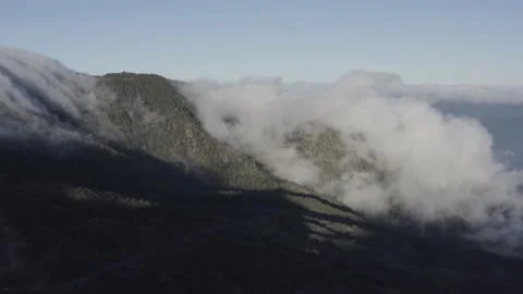 Aerial view. Clouds sea falling down from the mountain to valley-4. Drone shot. Stock Footage 158557031