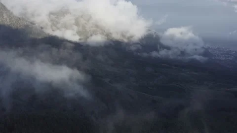 Aerial view. Clouds sea falling down from the mountain to valley-1. Drone shot. Stock Footage 158557180