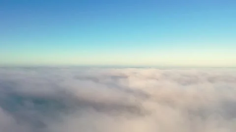 Aerial view up from the clouds to the sky in motion. Stock Footage 225051712