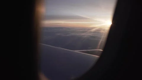 Aerial view of Cloudscape in dawn through plane window Stock Footage 249159591