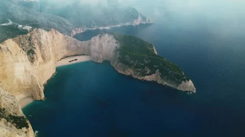 Aerial view in a cloudy day of the Navagio beach with the famous wrecked sh.. Stock Footage 310181231