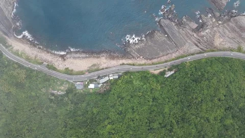Aerial view of cloudy sky and shadows moving over Longdong coastal road, Taiwan Stock Footage 343948368