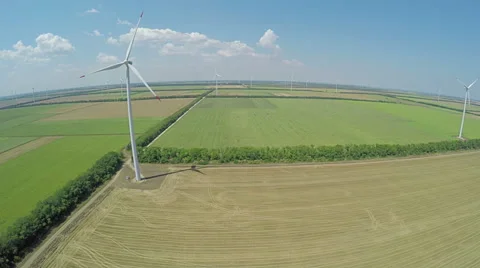 Aerial view of cluster of wind turbines in rural agriculture field Stock Footage 60690946