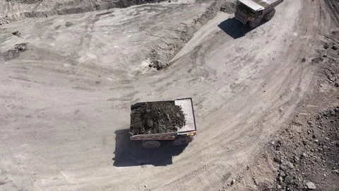 Aerial view of coal-carrying machine in a coal mine Stock Footage 294099100