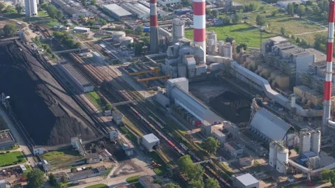Aerial view of a coal fired power plant with a freight train Vídeos de archivo 344879576