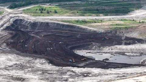 Aerial view of coal loading and unloading activities at a coal mine in a bl.. Stock Footage 337810451