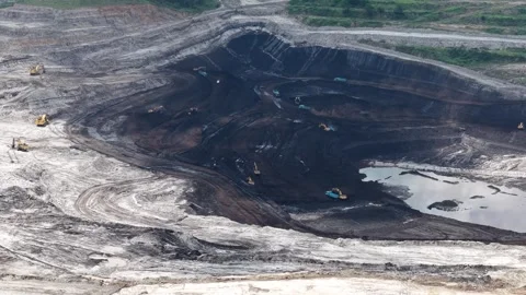 Aerial view of coal loading and unloading activities at a coal mine in a bl.. Stock Footage 337810481