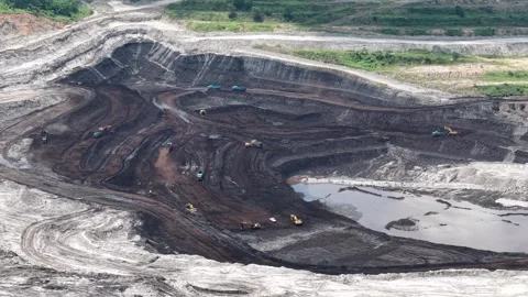 Aerial view of coal loading and unloading activities at a coal mine in a bl.. Stock Footage 337810731