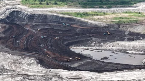 Aerial view of coal loading and unloading activities at a coal mine in a bl.. Stock Footage 337810733