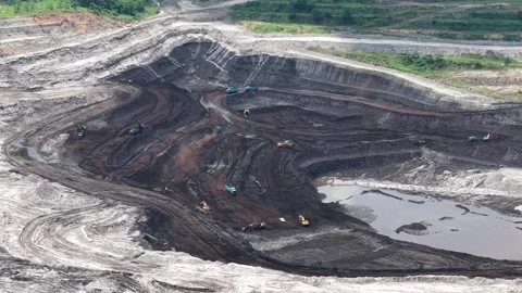 Aerial view of coal loading and unloading activities at a coal mine in a bl.. Stock Footage 337810773