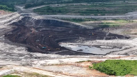 Aerial view of coal loading and unloading activities at a coal mine in a bl.. Stock Footage 337810937