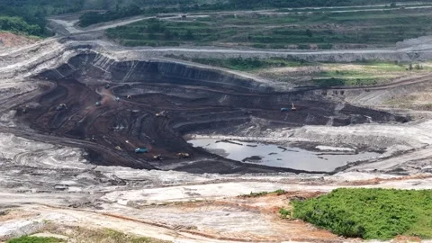 Aerial view of coal loading and unloading activities at a coal mine in a bl.. Stock Footage 337810939