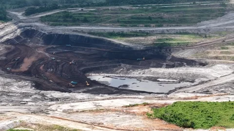 Aerial view of coal loading and unloading activities at a coal mine in a bl.. Stock Footage 337811047