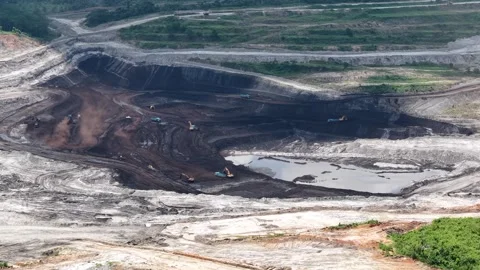 Aerial view of coal loading and unloading activities at a coal mine in a bl.. Stock Footage 337811162
