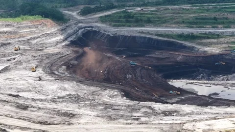 Aerial view of coal loading and unloading activities at a coal mine in a bl.. Stock Footage 337811187