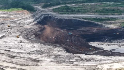 Aerial view of coal loading and unloading activities at a coal mine in a bl.. Stock Footage 337811222