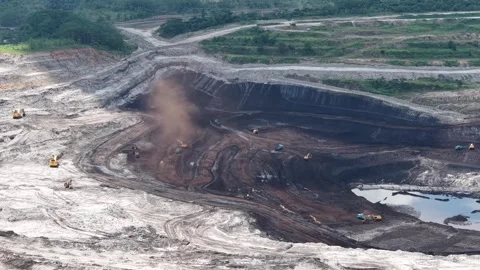 Aerial view of coal loading and unloading activities at a coal mine in a bl.. Stock Footage 337811357
