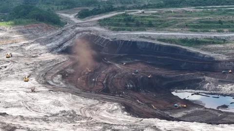 Aerial view of coal loading and unloading activities at a coal mine in a bl.. Stock Footage 337811425
