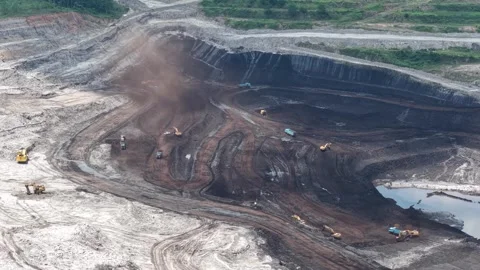 Aerial view of coal loading and unloading activities at a coal mine in a bl.. Stock Footage 337811433