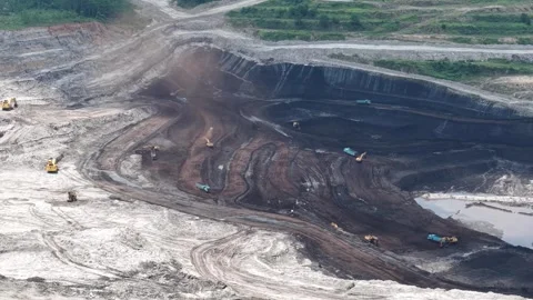 Aerial view of coal loading and unloading activities at a coal mine in a bl.. Stock Footage 337811499