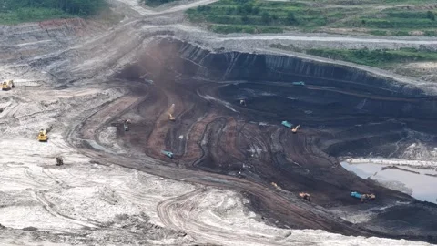Aerial view of coal loading and unloading activities at a coal mine in a bl.. Stock Footage 337811615