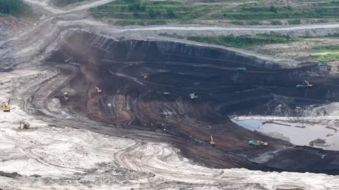 Aerial view of coal loading and unloading activities at a coal mine in a bl.. Stock Footage 337811623