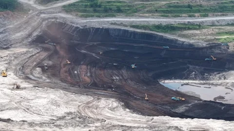 Aerial view of coal loading and unloading activities at a coal mine in a bl.. Stock Footage 337811633