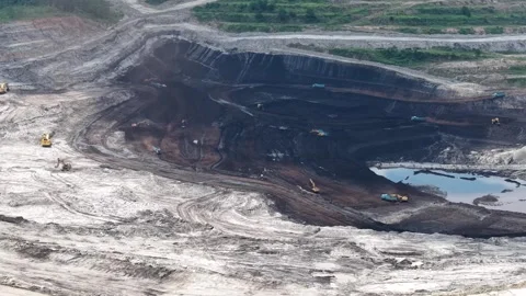 Aerial view of coal loading and unloading activities at a coal mine in a bl.. Stock Footage 337811796