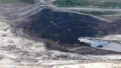 Aerial view of coal loading and unloading activities at a coal mine in a bl.. Stock Footage 337811843