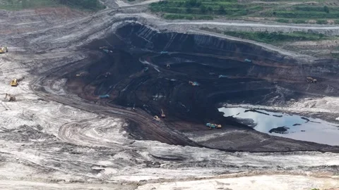 Aerial view of coal loading and unloading activities at a coal mine in a bl.. Stock Footage 337811845