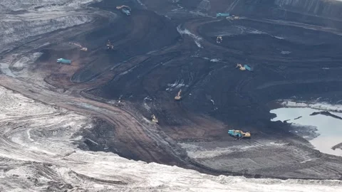 Aerial view of coal loading and unloading activities at a coal mine in a mi.. Stock Footage 337812703