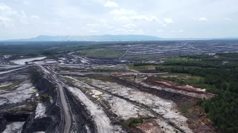 Aerial view of coal mining activities and transport trucks passing back and.. Stock Footage 328712067