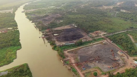 Aerial view of coal mining operations in Anggana, Indonesia. Stock Footage 346665445