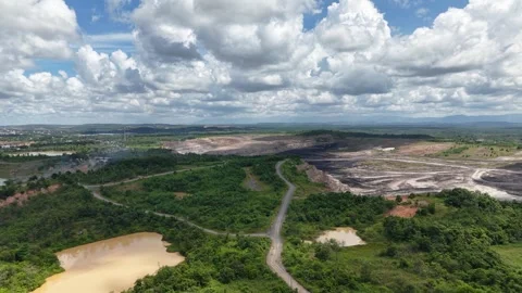 Aerial view of a coal mining site right next to a highway with deep excavat.. Stock Footage 342477791
