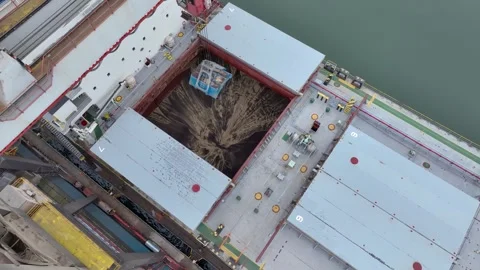 Aerial view of a coal ship being unloaded by cranes in a port Stock Footage 309752079