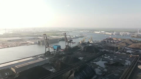 Aerial view of a coal storage facility loading dock in Amsterdam Westpoort, The Stock Footage 164655231