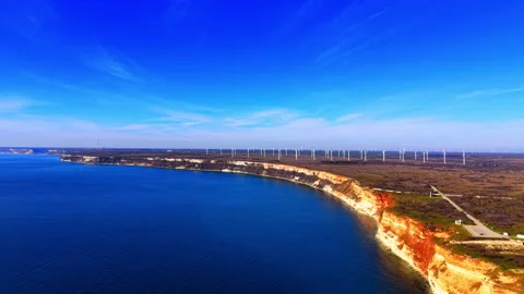 Aerial view of coastal cliffs and wind farm Stock Footage 329623726
