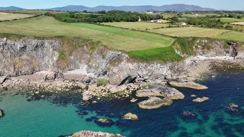 Aerial View of Coastal Cliffs and Rocky Shore in 4K Stock-Footage 332943313