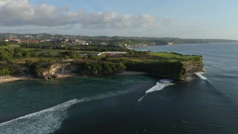 Aerial View of Coastal Cliffs and Breaking Waves at Balangan Beach, Bali Video stock 337607030
